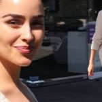 Olivia Culpo pictured the help of boyfriend McCaffrey to slip her enviable frame into a pair of skintight leather pants.