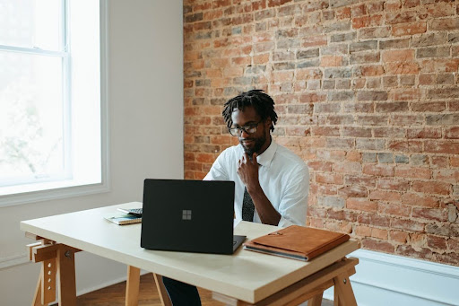 unnamed - 2024-04-15T114327.677 A businessman working at a desk on a laptop